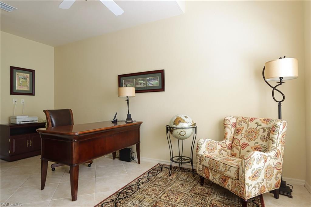 5815 Persimmon Way Naples, FL 34110 - Photo 17 of 24 a living room with furniture and a window