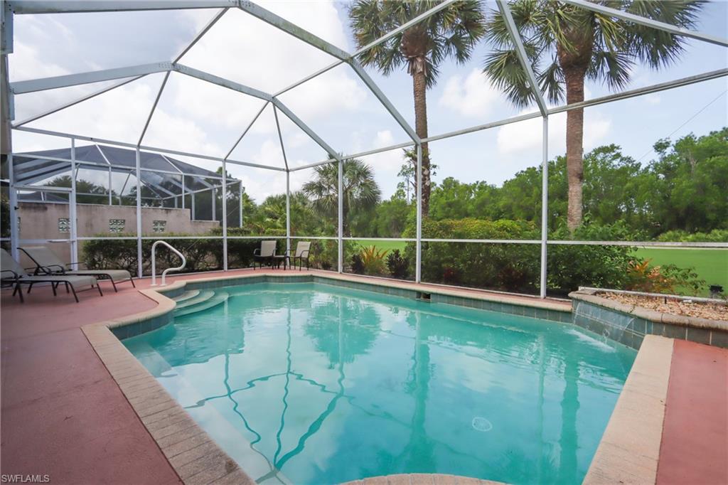 5815 Persimmon Way Naples, FL 34110 - Photo 23 of 24 a view of a backyard with swimming pool