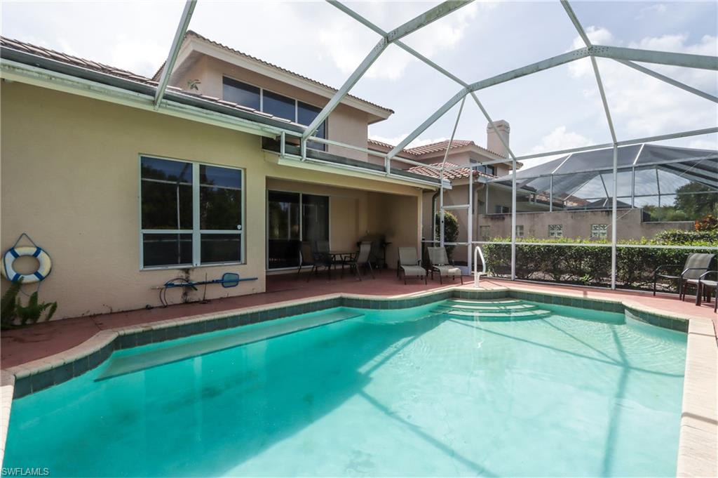 5815 Persimmon Way Naples, FL 34110 - Photo 24 of 24 a view of a house with a backyard porch and sitting area