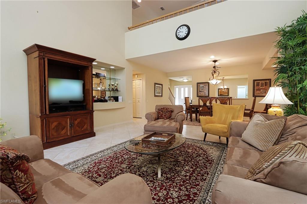 5815 Persimmon Way Naples, FL 34110 - Photo 3 of 24 a living room with furniture and a flat screen tv