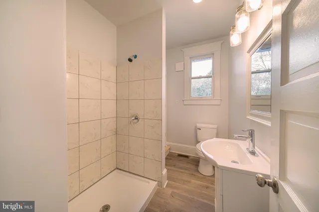a kitchen with stainless steel appliances a stove sink and cabinets