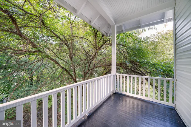 a view of an empty room with stairs and ventilation