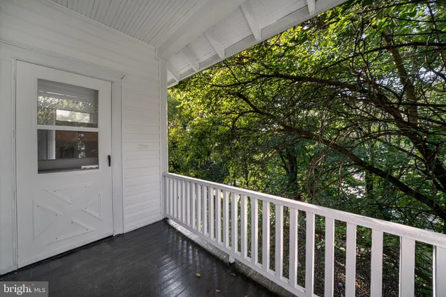 a view of entryway with stairs and wooden floor