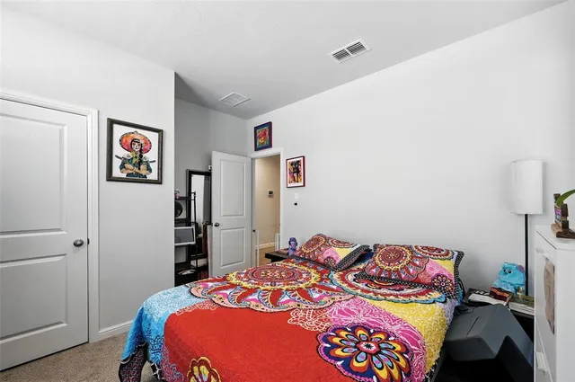 a view of walk in closet with clothes