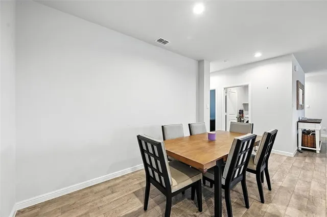 a kitchen with stainless steel appliances granite countertop a stove a microwave and cabinets