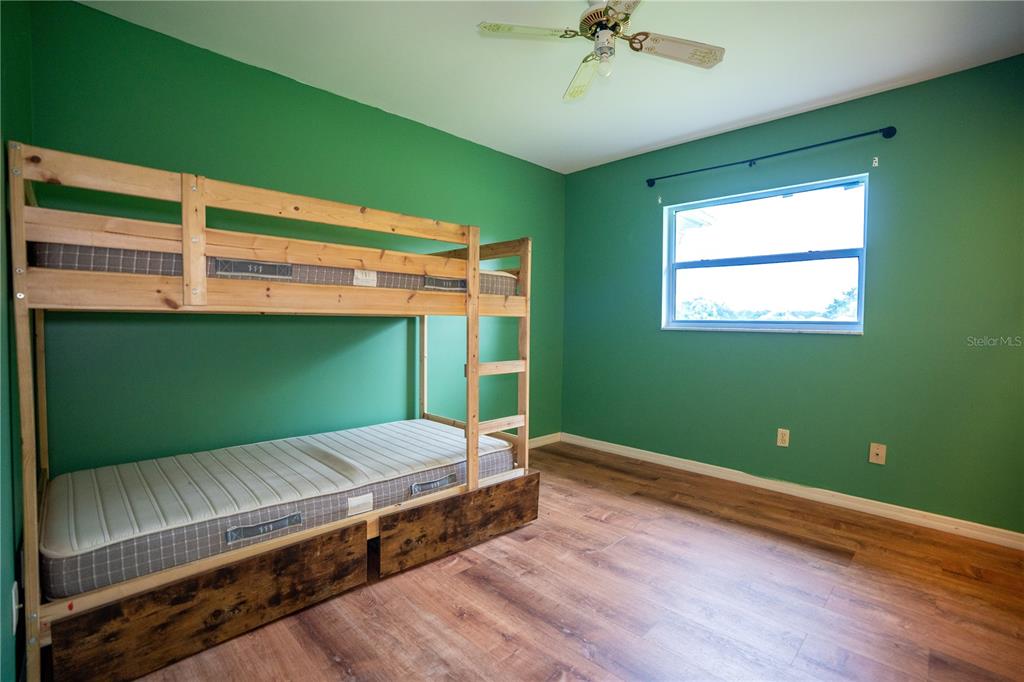 417 L Lanier Road Fort Meade, FL 33841 - Photo 13 of 36 a bedroom with a bed and a window