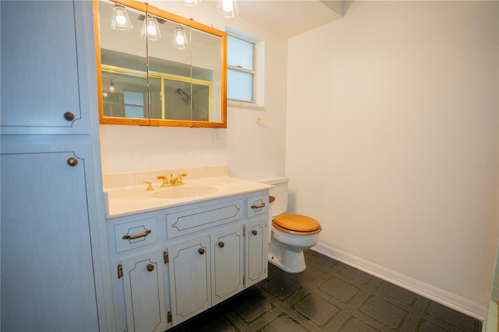 417 L Lanier Road Fort Meade, FL 33841 - Photo 18 of 36 a bathroom with a toilet a sink and a window