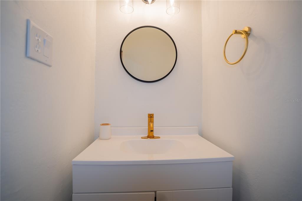 417 L Lanier Road Fort Meade, FL 33841 - Photo 28 of 36 a bathroom with a sink and a mirror