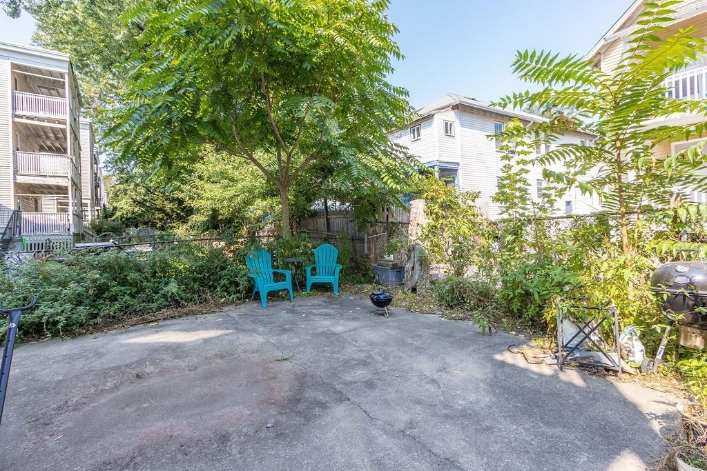 40 Stellman Road, Unit 33 Boston, MA 02131 - Photo 19 of 20 a view of a house with a tree and a yard