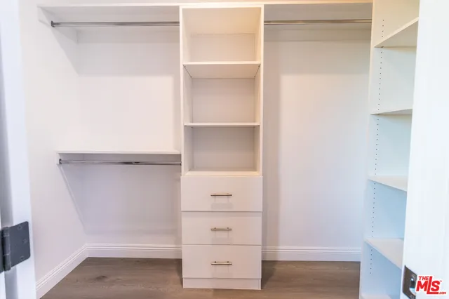 a view of an empty walk in closet