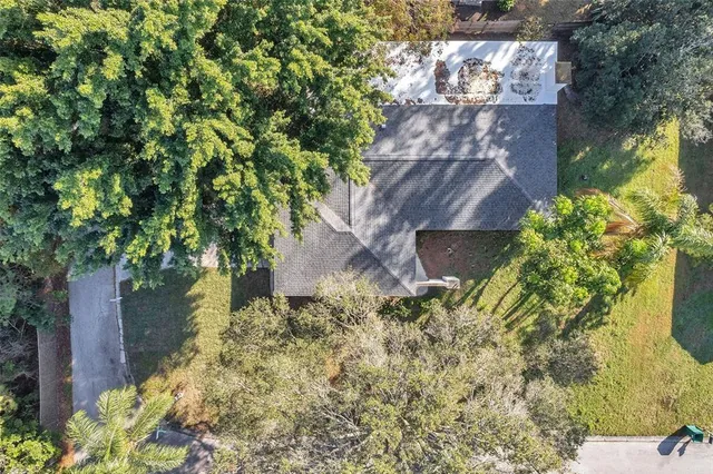 a backyard of a house with outdoor seating