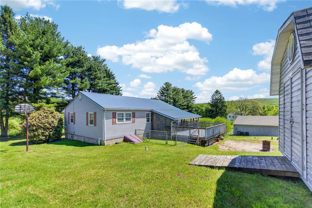 62 Stoney Road Tamaqua, PA 18252 - Photo 56 of 61 A countryside retreat offering an expansive yard and a wide deck for outdoor enjoyment.