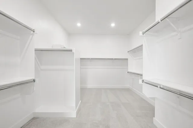 a view of an empty walk in closet