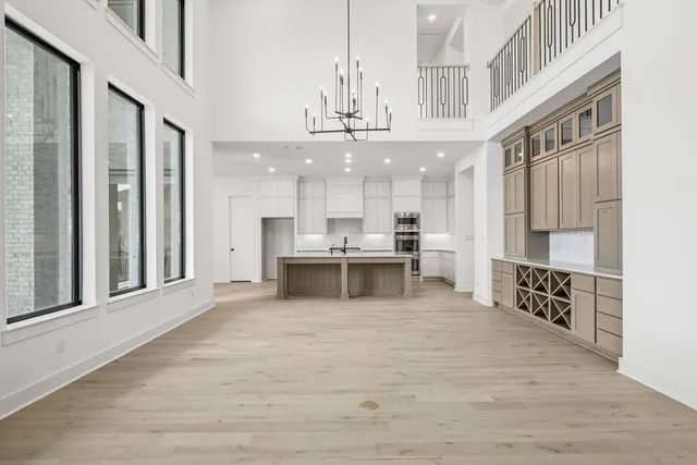 a view of kitchen with stainless steel appliances granite countertop a large counter top and oven
