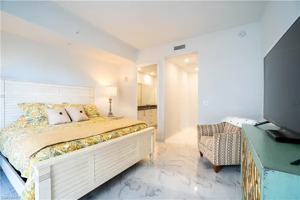 a bathroom with a sink a mirror and a shower