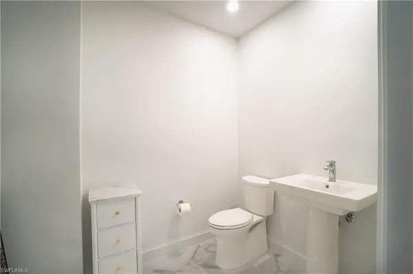 a bathroom with a shower and a toilet