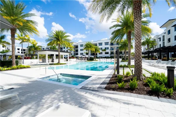 a house with palm tree in front of it