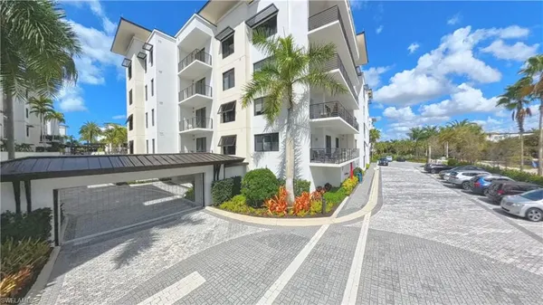 a view of a potted flower in the corridor