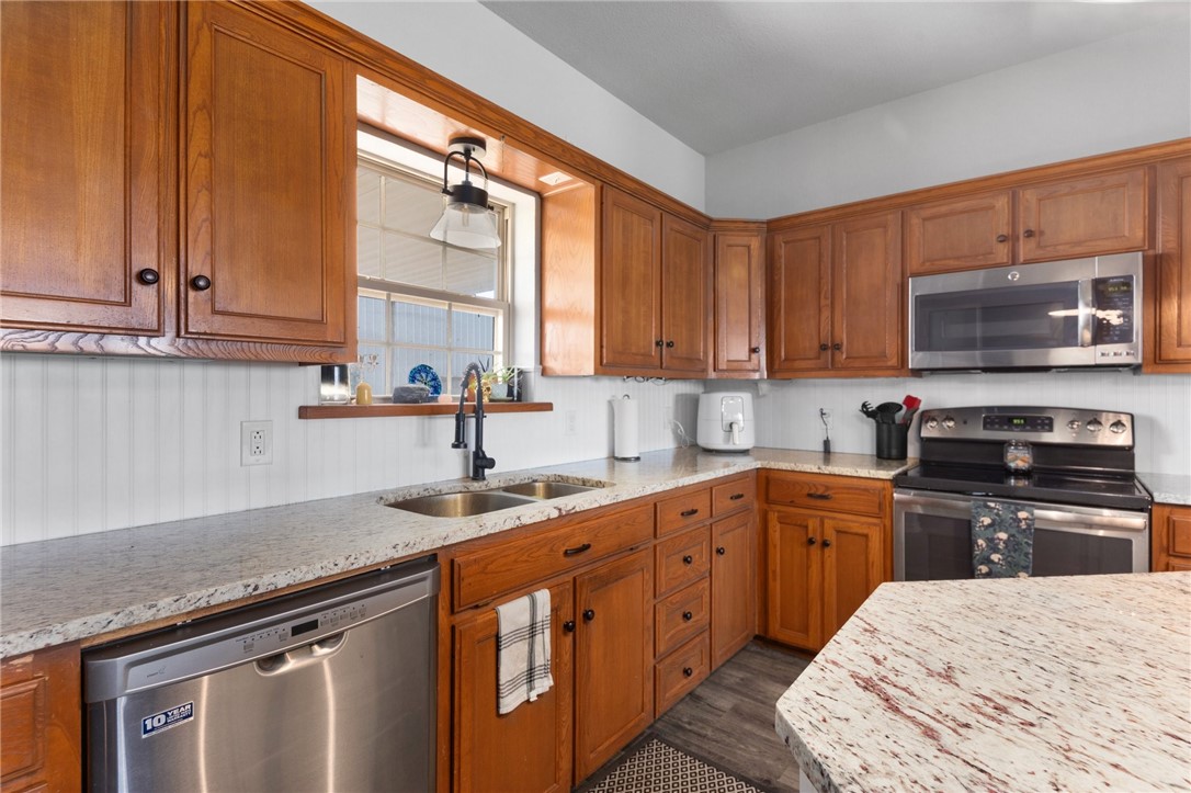 530 Joy Lynn Road Moody, TX 76557 - Photo 12 of 36 a kitchen with a sink stove and microwave