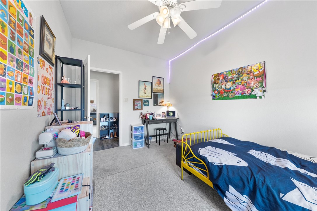 530 Joy Lynn Road Moody, TX 76557 - Photo 20 of 36 a bedroom with furniture and a chandelier