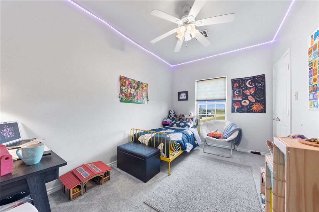 530 Joy Lynn Road Moody, TX 76557 - Photo 21 of 36 a bedroom with furniture and a chandelier fan