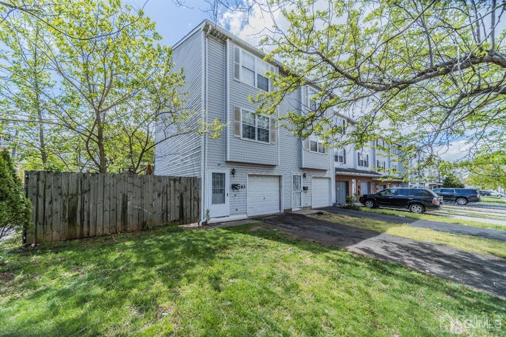 63 Larch Street Carteret, NJ 07008 - Photo 1 of 11 a view of a yard in front of house