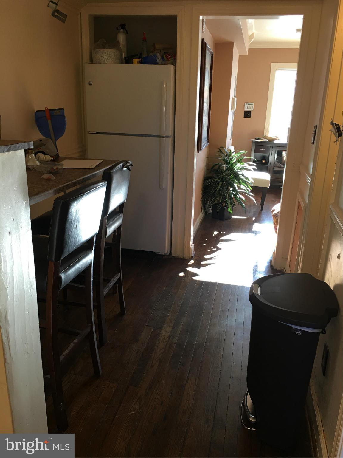 1242 Simms Place Northeast Washington, DC 20002 - Photo 4 of 14 a workspace with furniture and wooden floor