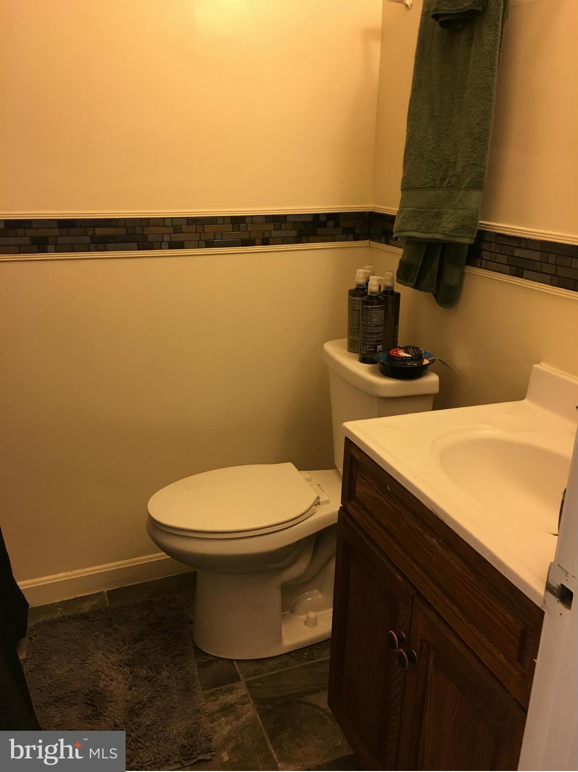 1242 Simms Place Northeast Washington, DC 20002 - Photo 6 of 14 a bathroom with a toilet and a sink