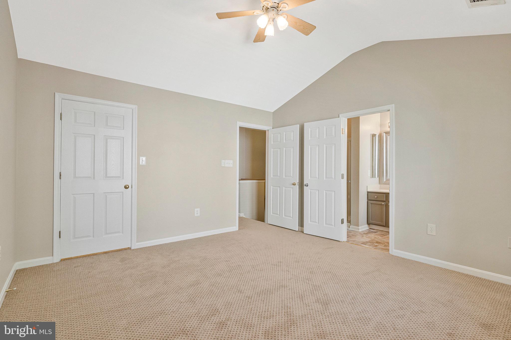 22011 Box Car Square Sterling, VA 20166 - Photo 6 of 19 a view of an empty room with a chandelier fan