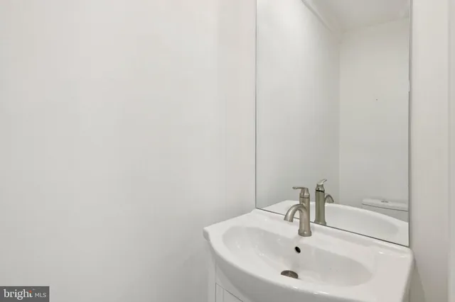 a view of room with wooden floor and window