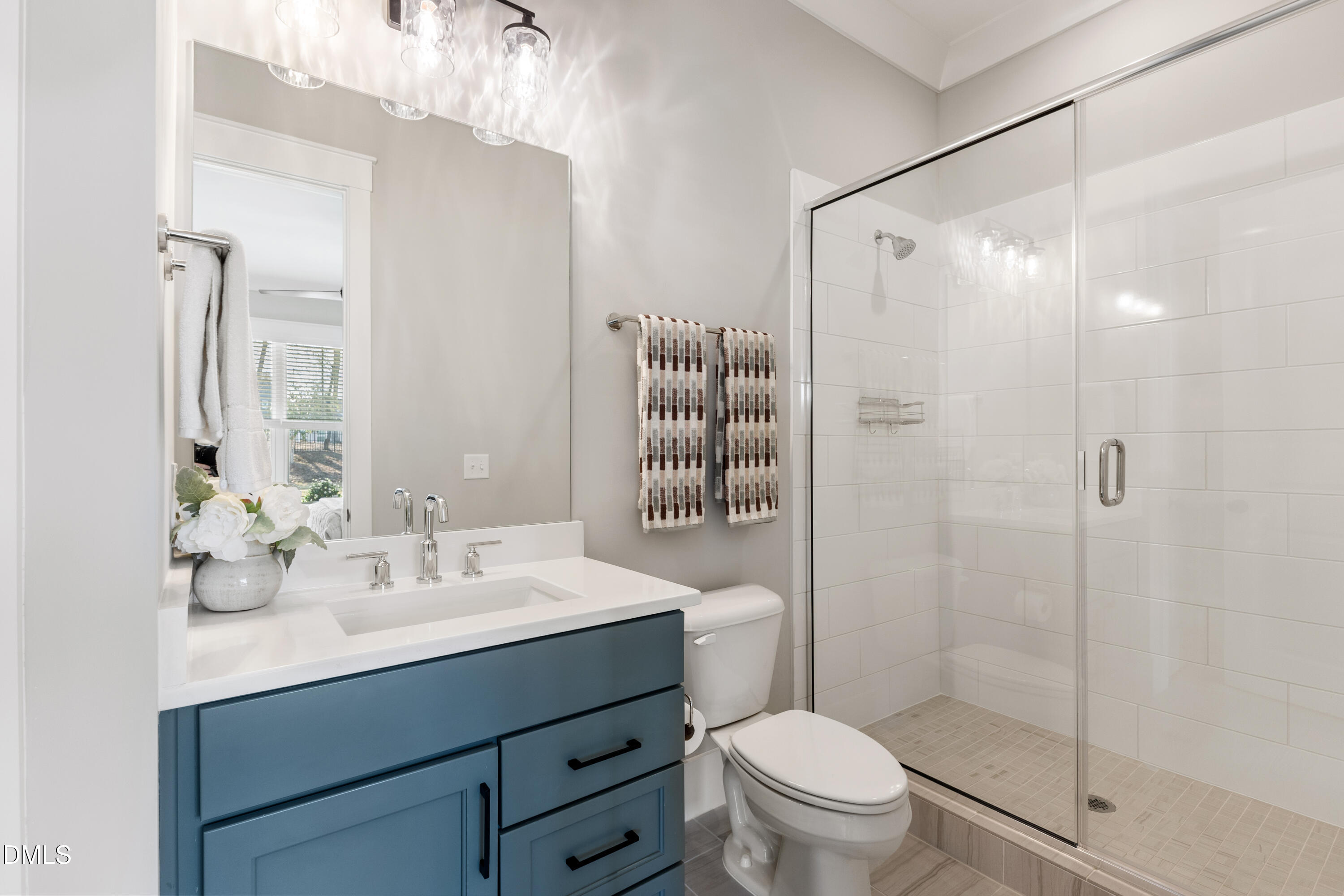 75 Cottage Way Pittsboro, NC 27312 - Photo 20 of 68 a bathroom with a sink toilet mirror and shower