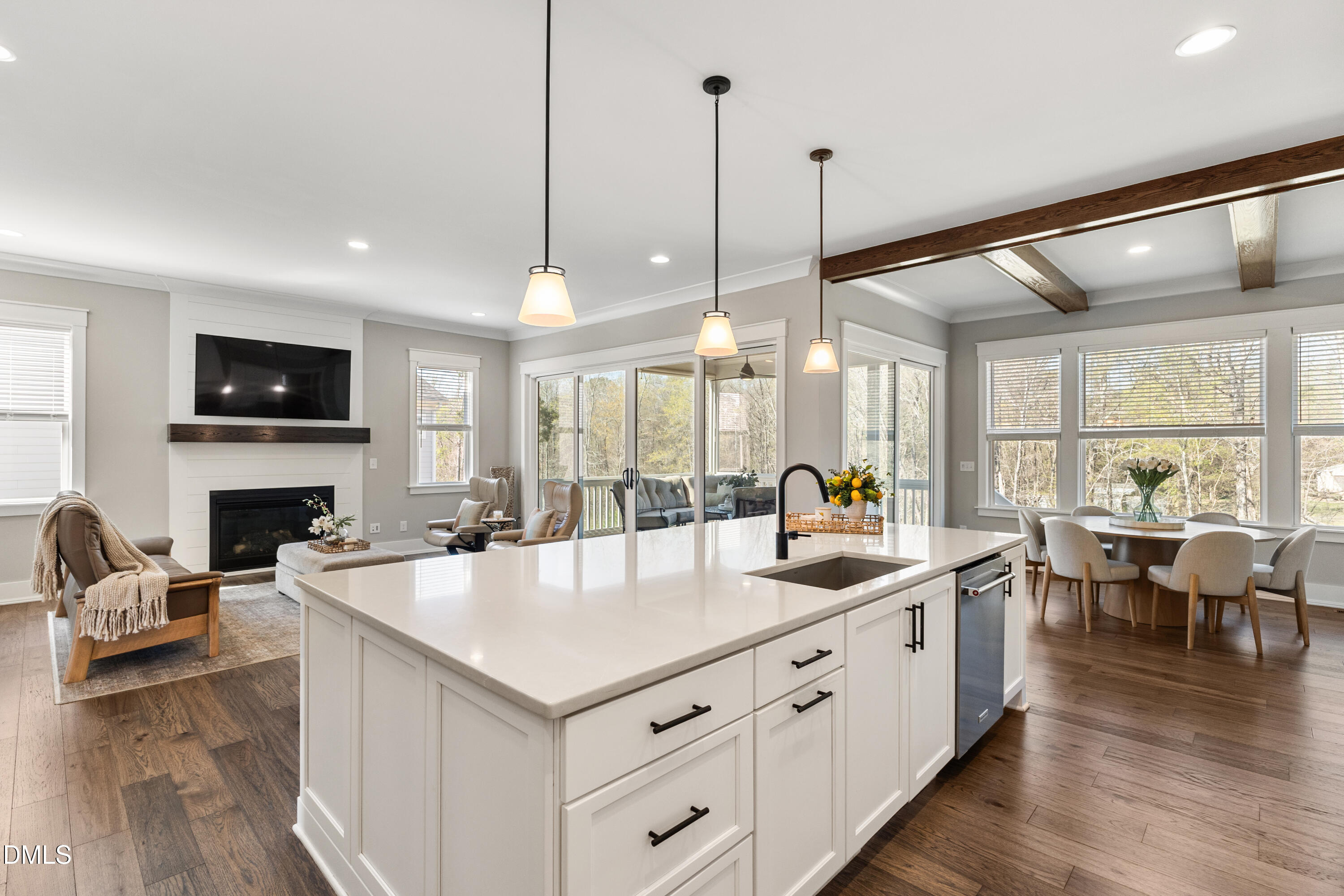75 Cottage Way Pittsboro, NC 27312 - Photo 6 of 68 a large kitchen with kitchen island a stove a sink a center island a dining table and chairs