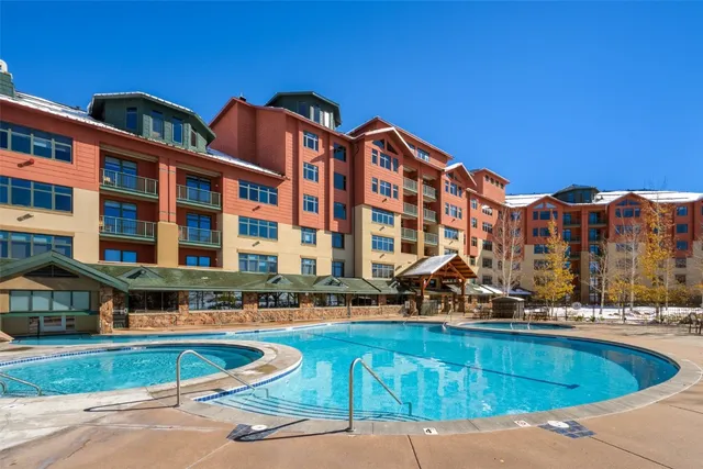 a front view of a building with swimming pool
