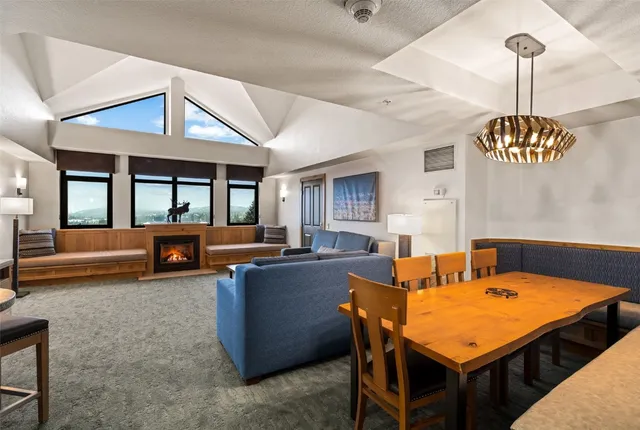 a living room with furniture and a table