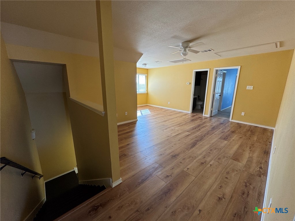 6801 Modesto Road Killeen, TX 76542 - Photo 18 of 26 a view of a hallway with wooden floor