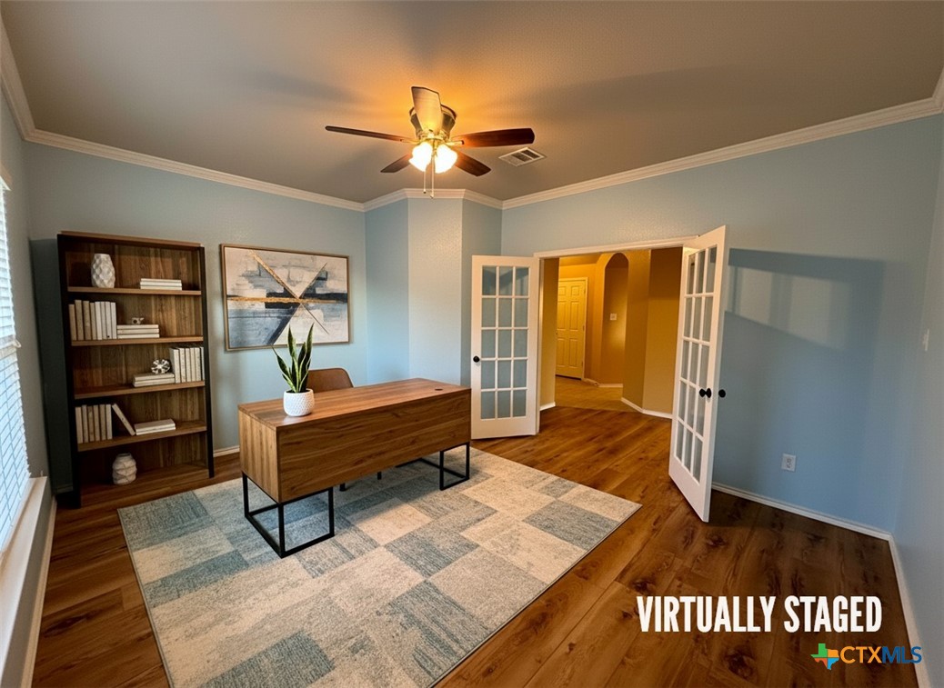 6801 Modesto Road Killeen, TX 76542 - Photo 5 of 26 a bedroom with a bed and a bookshelf