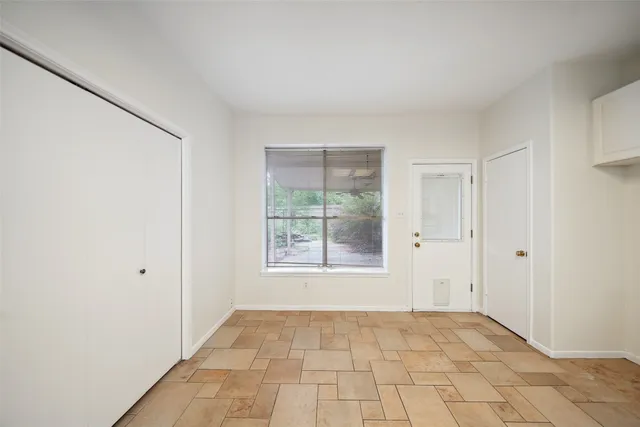 a view of an empty room with a window