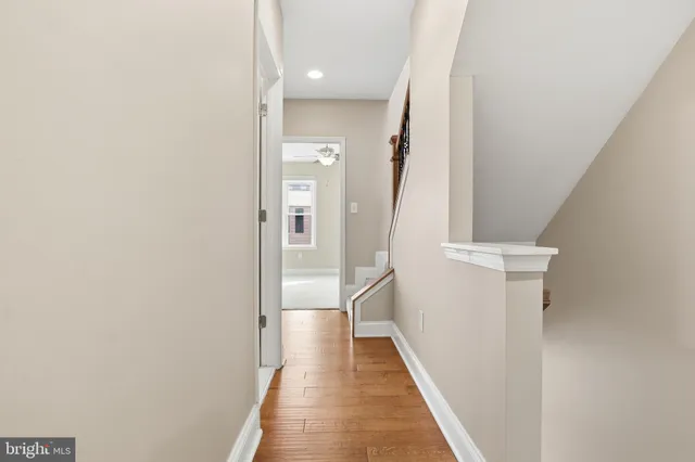 a bathroom with a bathtub sink vanity and mirror
