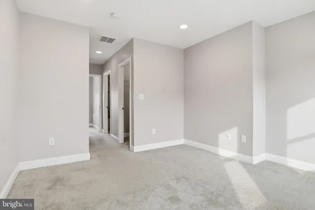 a view of a hallway with a white walls