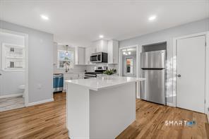 634 Newhall Street Hamden, CT 06517 - Photo 1 of 28 a kitchen with refrigerator and cabinets