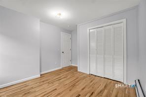 634 Newhall Street Hamden, CT 06517 - Photo 14 of 28 a view of an empty room and wooden floor