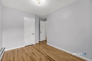 634 Newhall Street Hamden, CT 06517 - Photo 15 of 28 a view of empty room with wooden floor