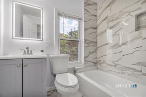 634 Newhall Street Hamden, CT 06517 - Photo 16 of 28 a bathroom with a sink toilet and shower
