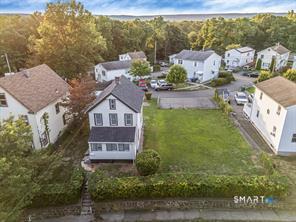 634 Newhall Street Hamden, CT 06517 - Photo 19 of 28 a aerial view of a house with a yard