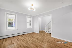634 Newhall Street Hamden, CT 06517 - Photo 3 of 28 a view of empty room with wooden floor and fan