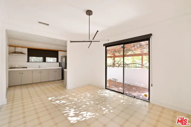 a view of a room with a sink and cabinet