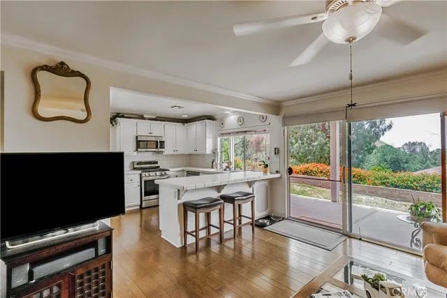 a kitchen with stainless steel appliances granite countertop a stove and a refrigerator