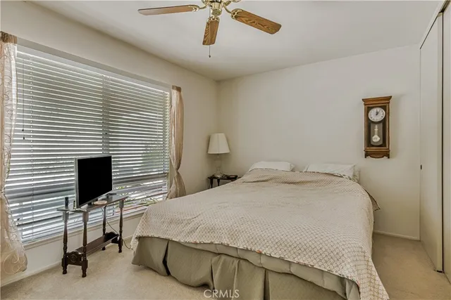 a bedroom with a bed and a table