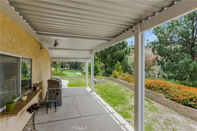 a view of swimming pool with a patio