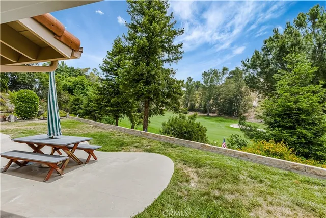 a view of a backyard with sitting area